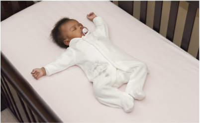Baby Sleeping in Crib Image